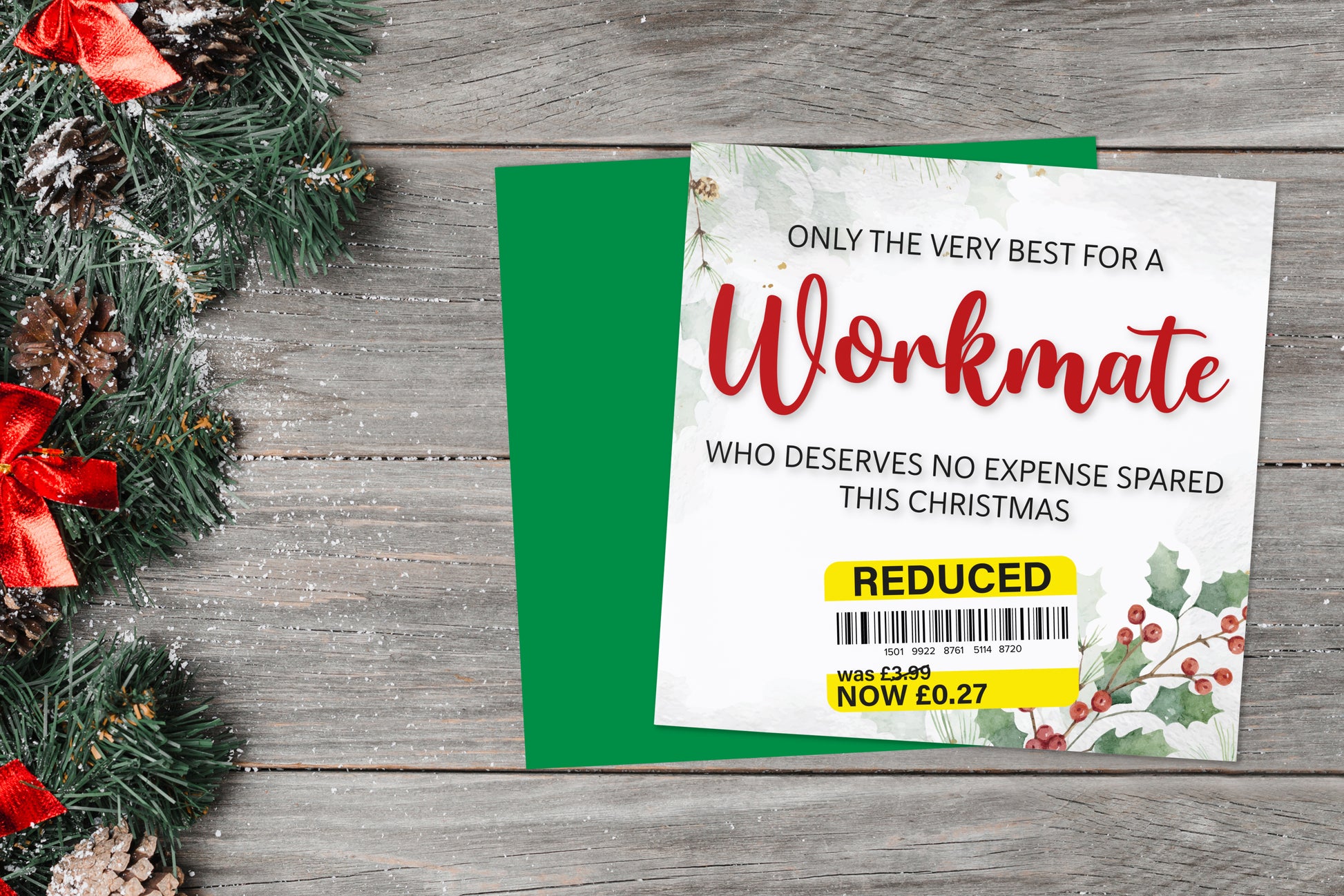 A greetings card on a blue background accompanied by flowers