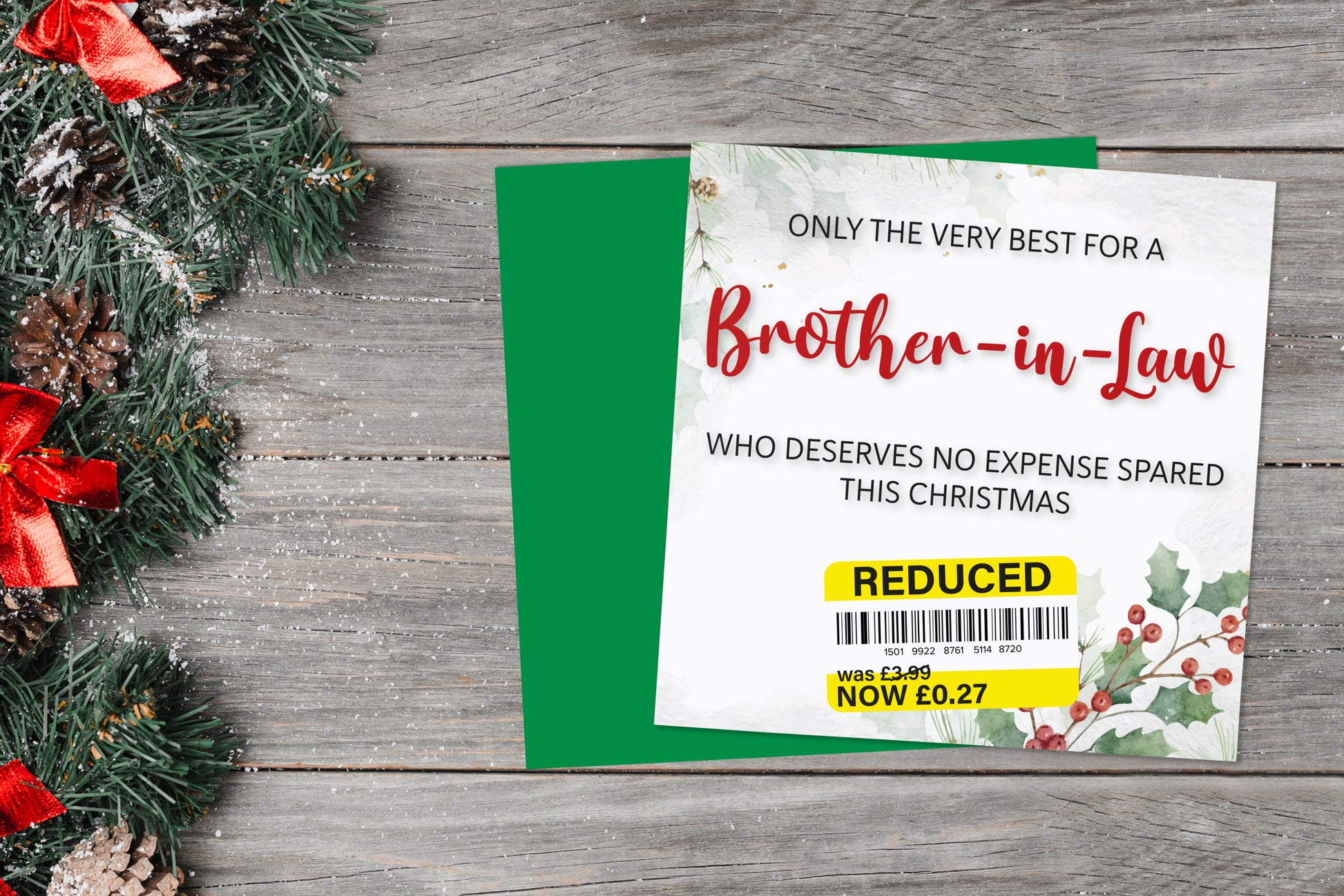 A greetings card on a blue background accompanied by flowers