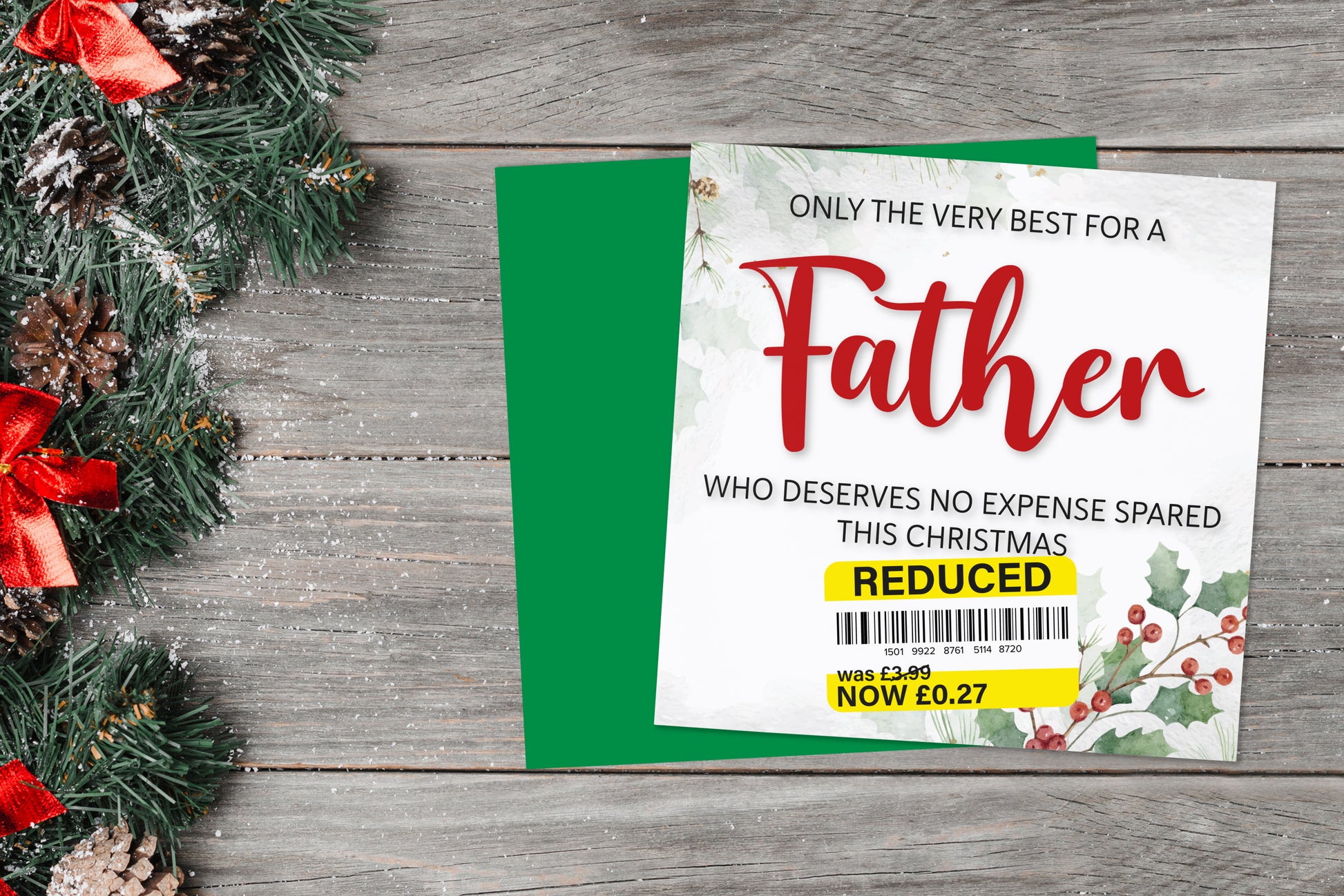 A greetings card on a blue background accompanied by flowers