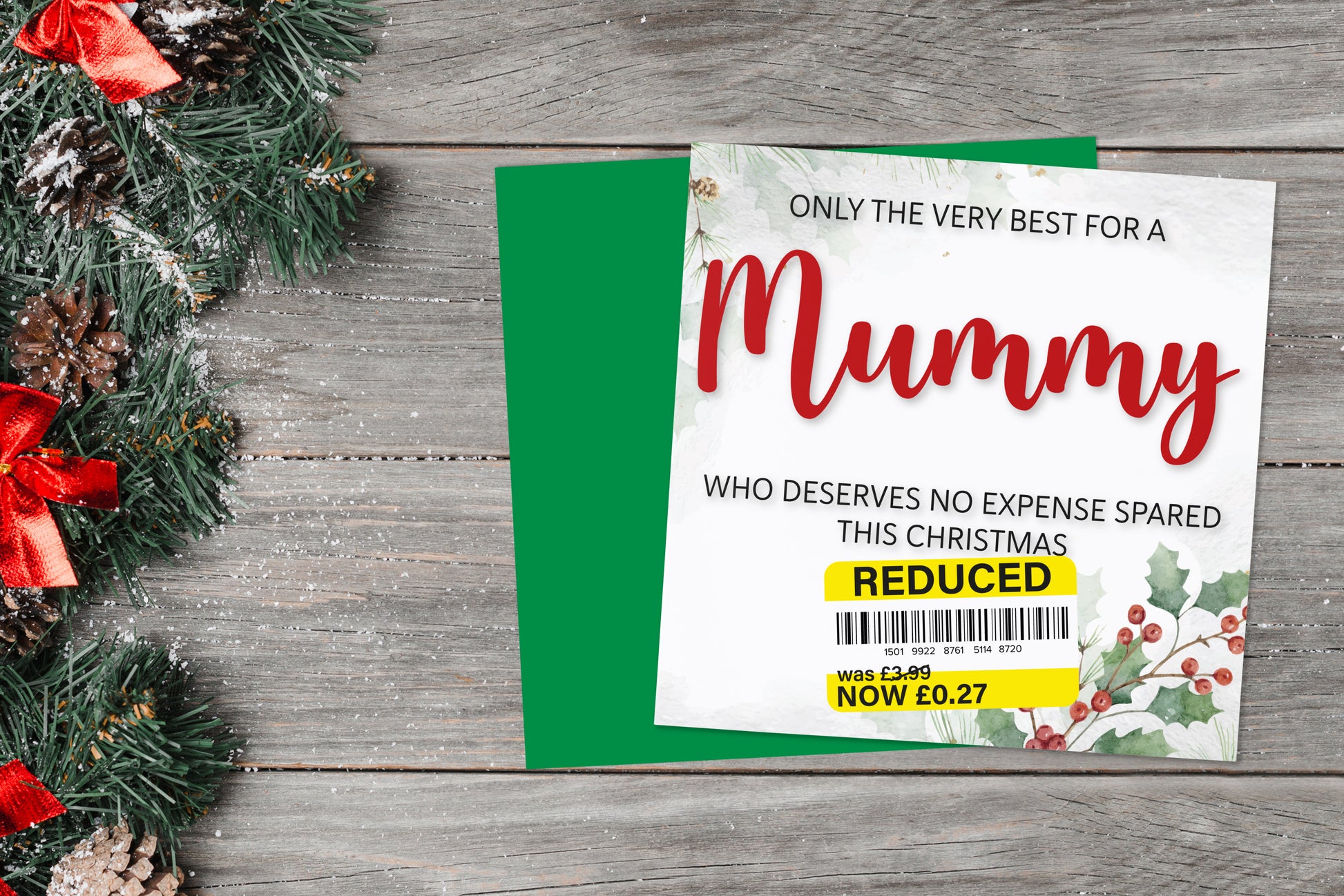 A greetings card on a blue background accompanied by flowers