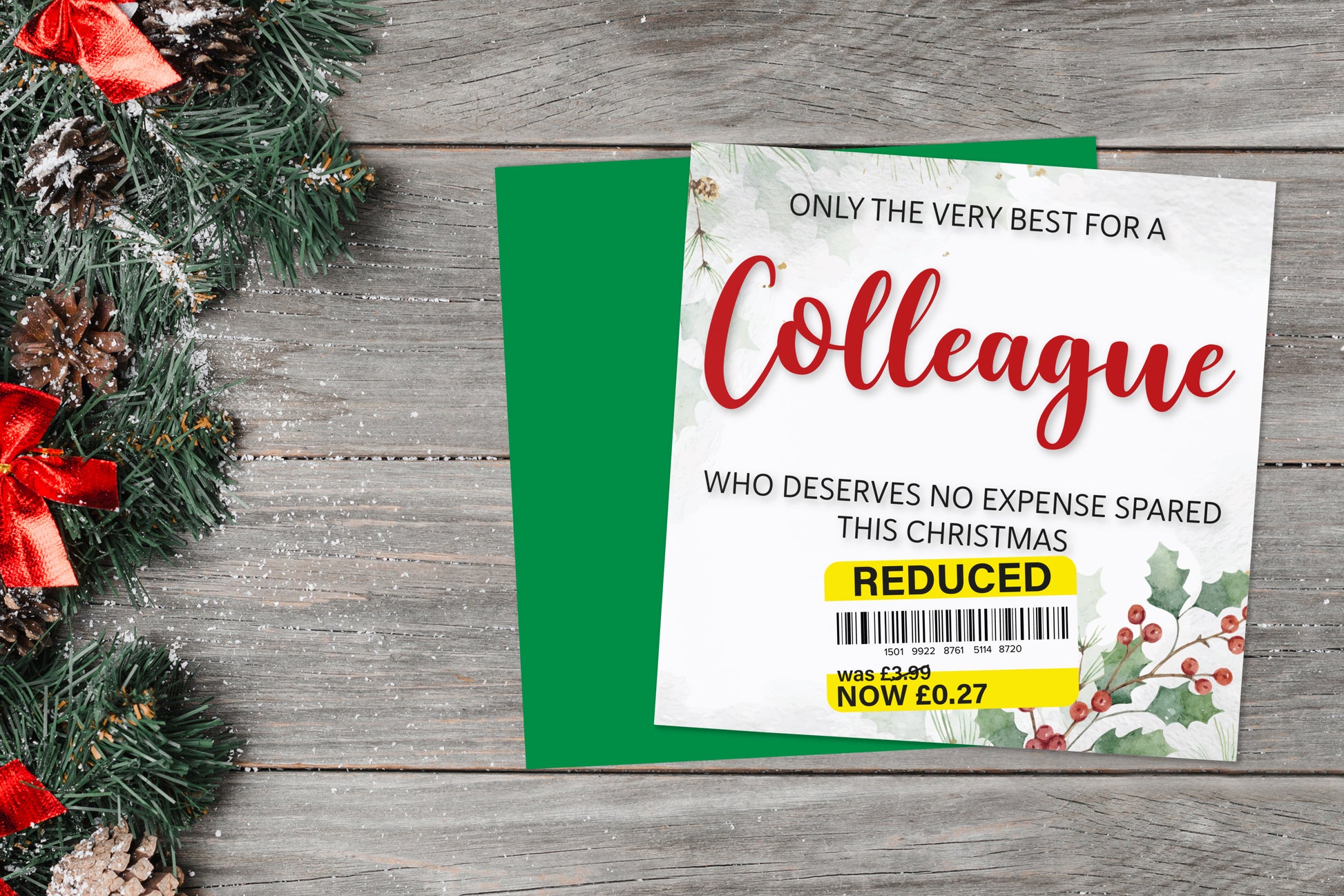 A greetings card on a blue background accompanied by flowers